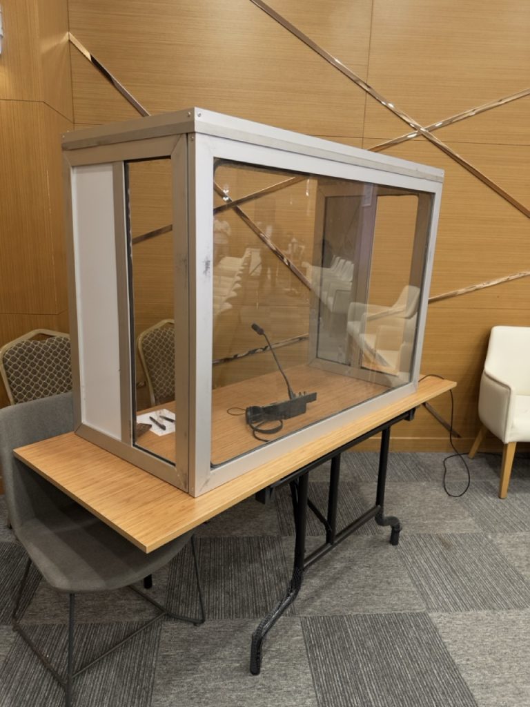 Simultaneous interpretation booth setup with microphone and interpreter console for multilingual conference event Maamuus events in Somalia