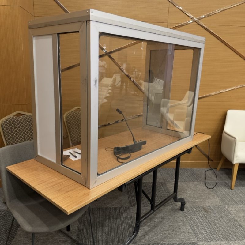 Simultaneous interpretation booth setup with microphone and interpreter console for multilingual conference event Maamuus events in Somalia